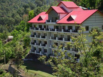 The majestic exterior of AHR The Dagshai Manor nestled amidst the verdant hills of Kasauli.